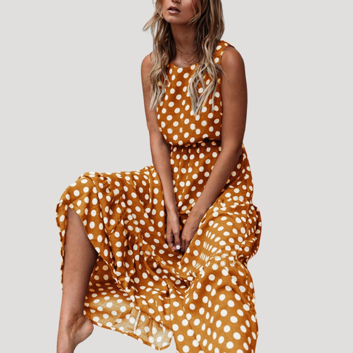 Elegant women's A-line midi dress with polka dots, sleeveless design, great for vacation or casual wear.
