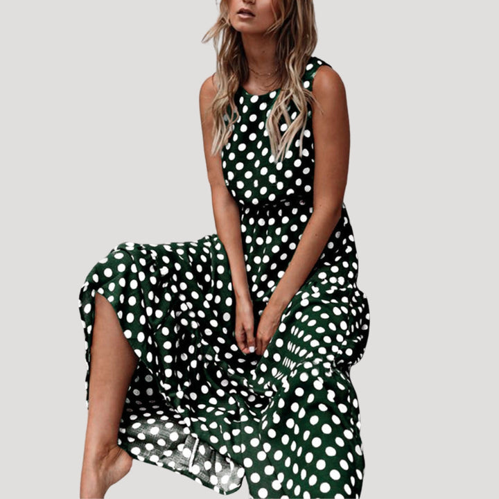 Comfortable women's polka dot sundress, sleeveless and flowy A-line midi style, perfect for warm days.
