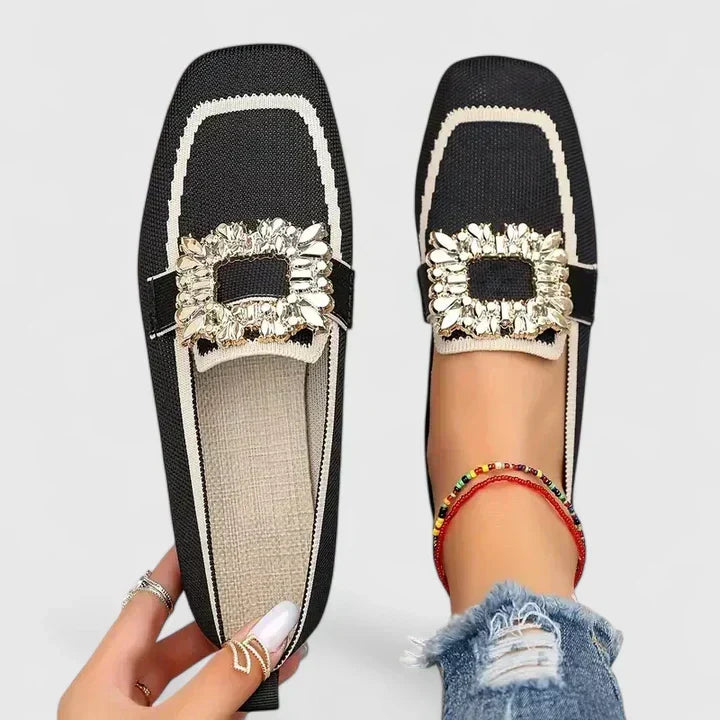 Casual slip-on flat mules for women with a trendy square toe and shimmering rhinestone buckle. Comfortable fashion slides.