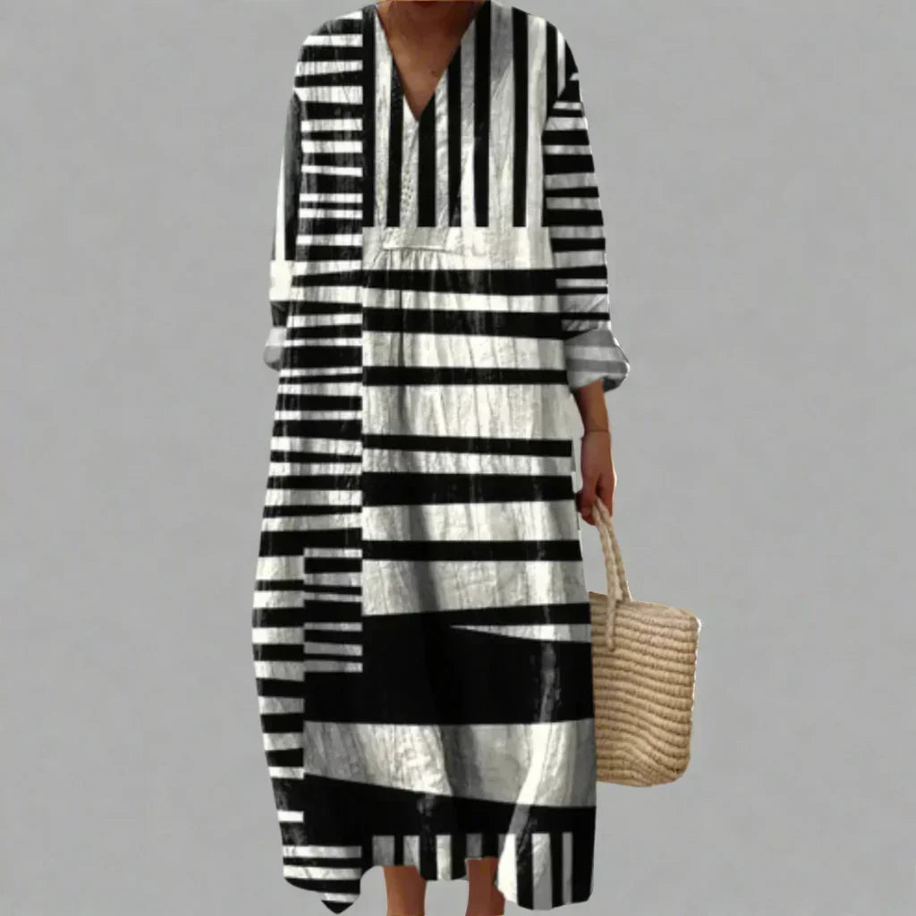 Women's black & white abstract linework V-neck dress. Elegant, modern, & versatile for casual or evening wear.