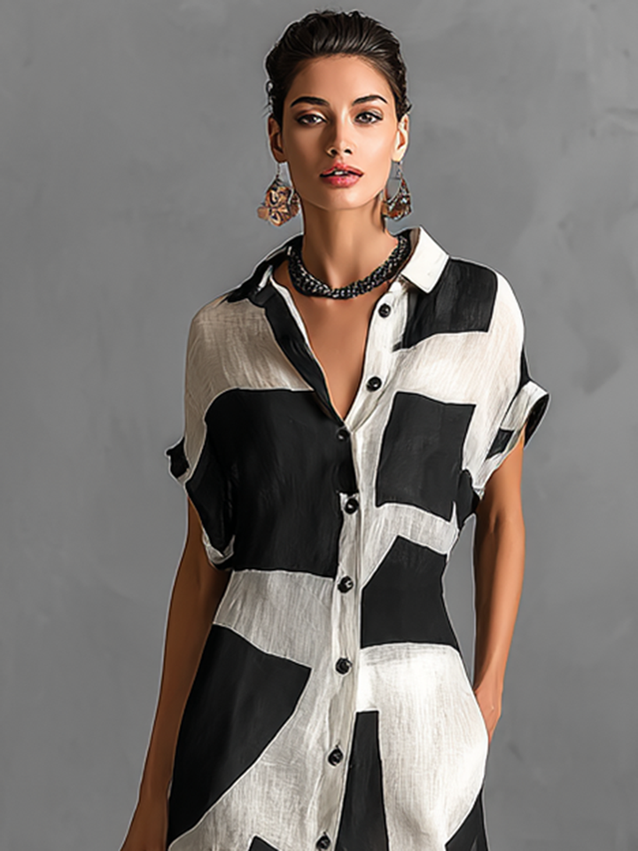 Fashionable women's black & white color block maxi shirt dress. Lapel collar & short sleeves for summer.