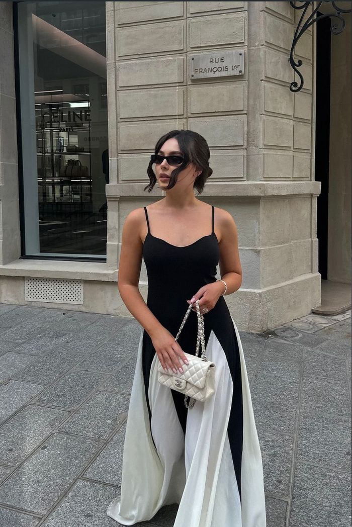 Glamorous women's black & white evening gown, a chic and elegant formal dress for wedding guests.