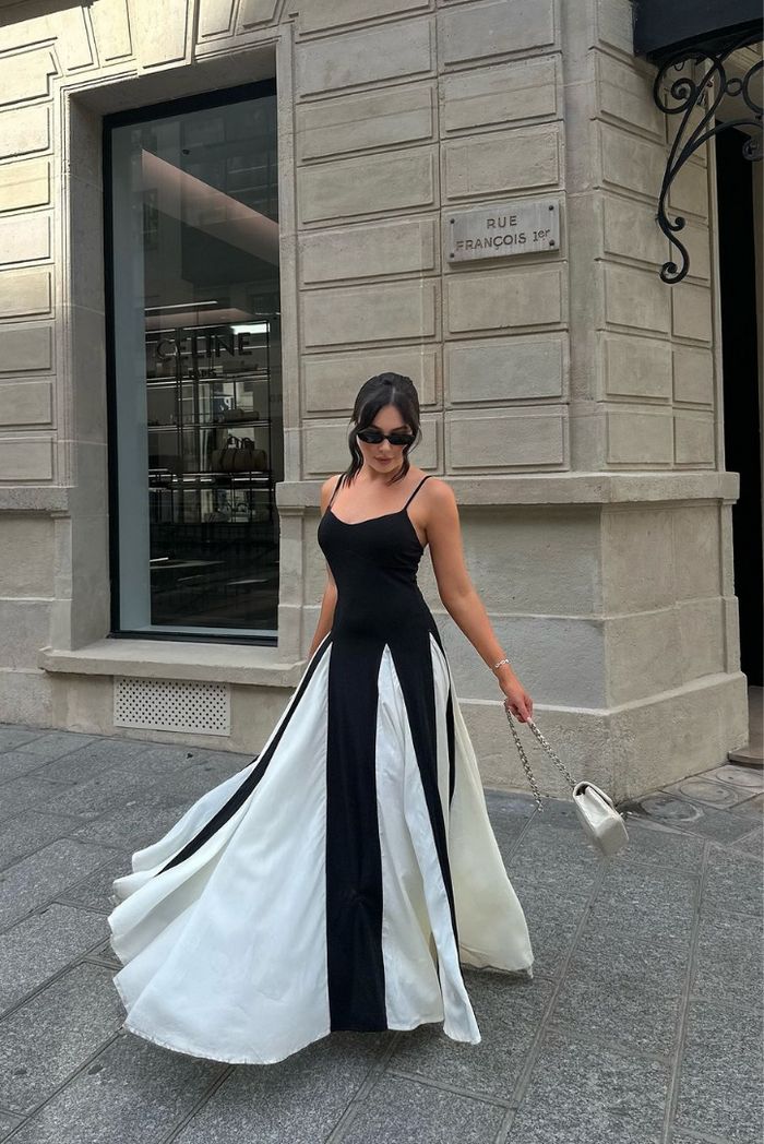 Women's long elegant wedding guest dress with black & white contrast and flattering sweetheart neckline.