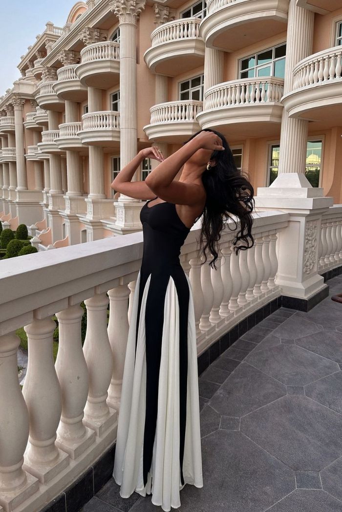 Women's long wedding guest dress with a sweetheart neckline, striking contrast panels, and elegant flow.