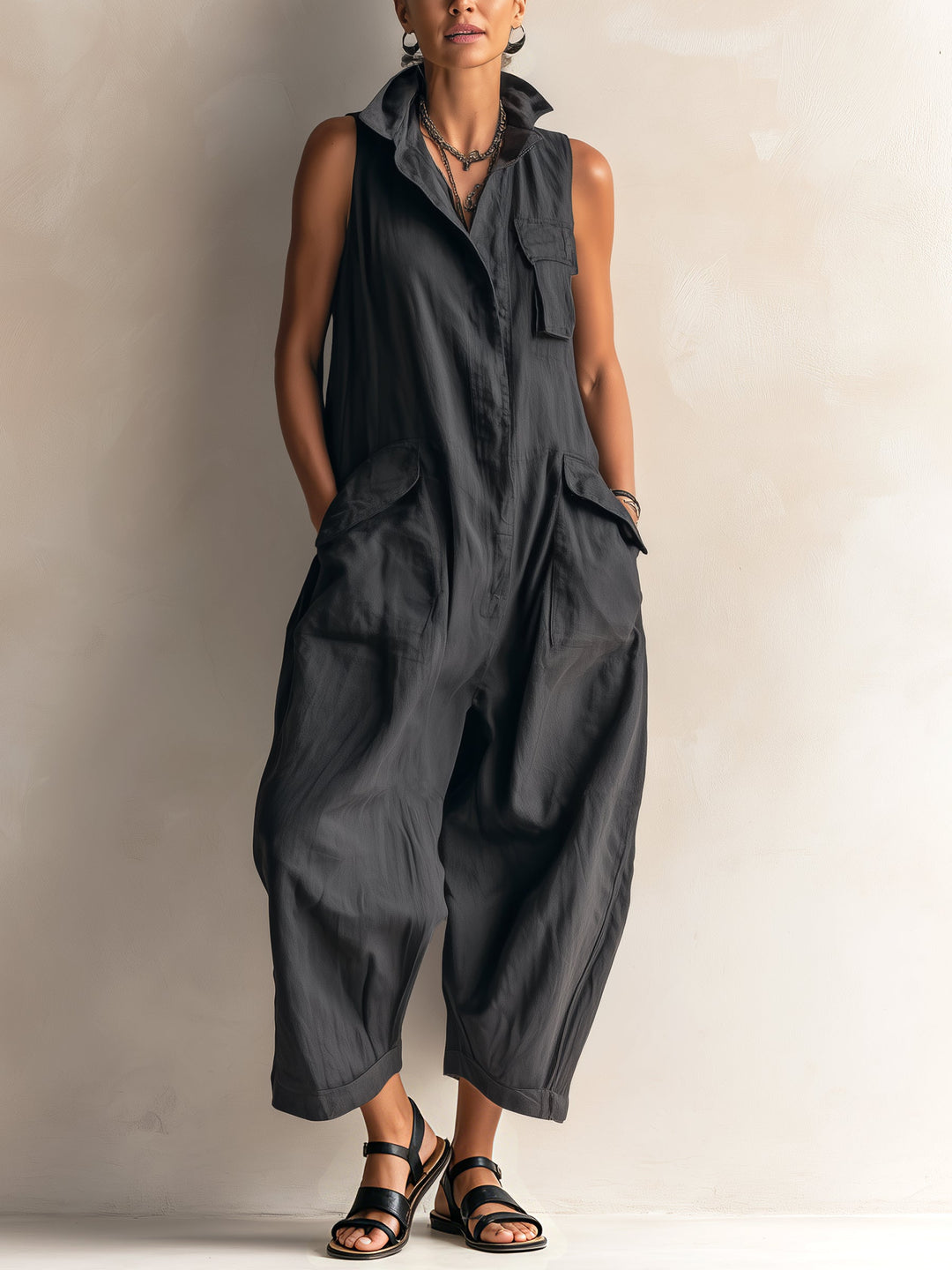Women's black wide-leg jumpsuit, sleeveless with a chic collar. Effortless and comfortable for versatile casual wear.