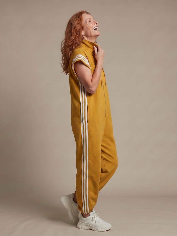 Women's black full length jumpsuit, zip front for easy wear, with athletic side stripe accents. Relaxed fit.