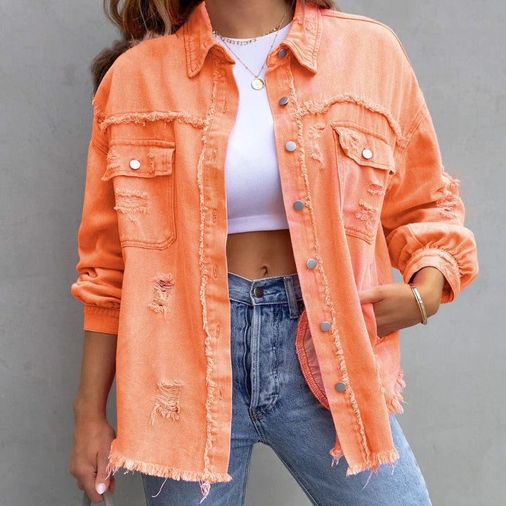 Women's blue frayed denim jacket, an edgy and distressed style perfect for casual layering outfits.