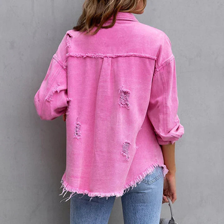 Back view of a stylish women's frayed denim jacket, perfect new arrival outerwear for casual edgy looks.