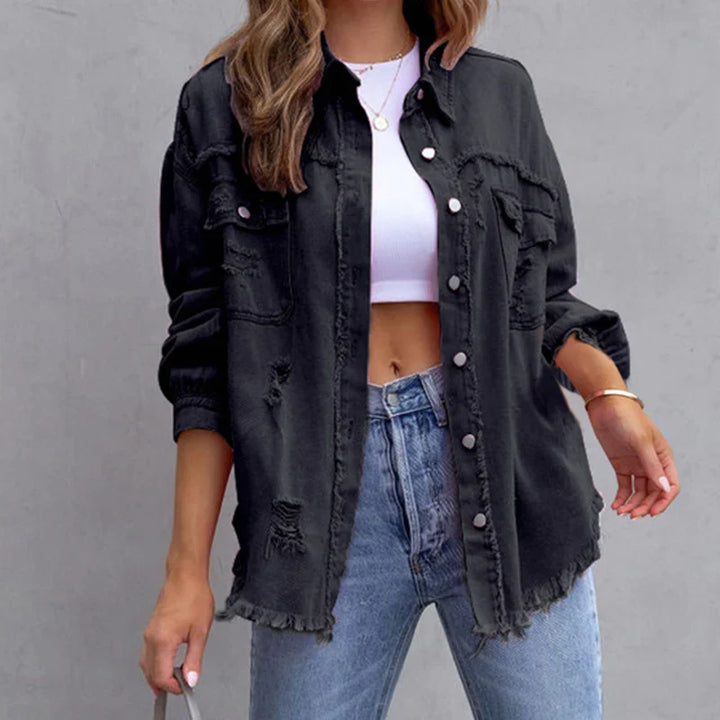 Women's frayed denim jacket layered over a top, offering an edgy and casual new arrival fashion style.