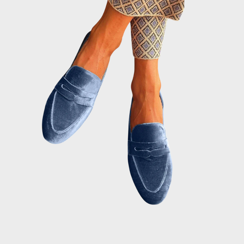 Women's blue slip-on loafers, offering effortless style & comfort. Perfect for casual wear, spring & summer outfits.