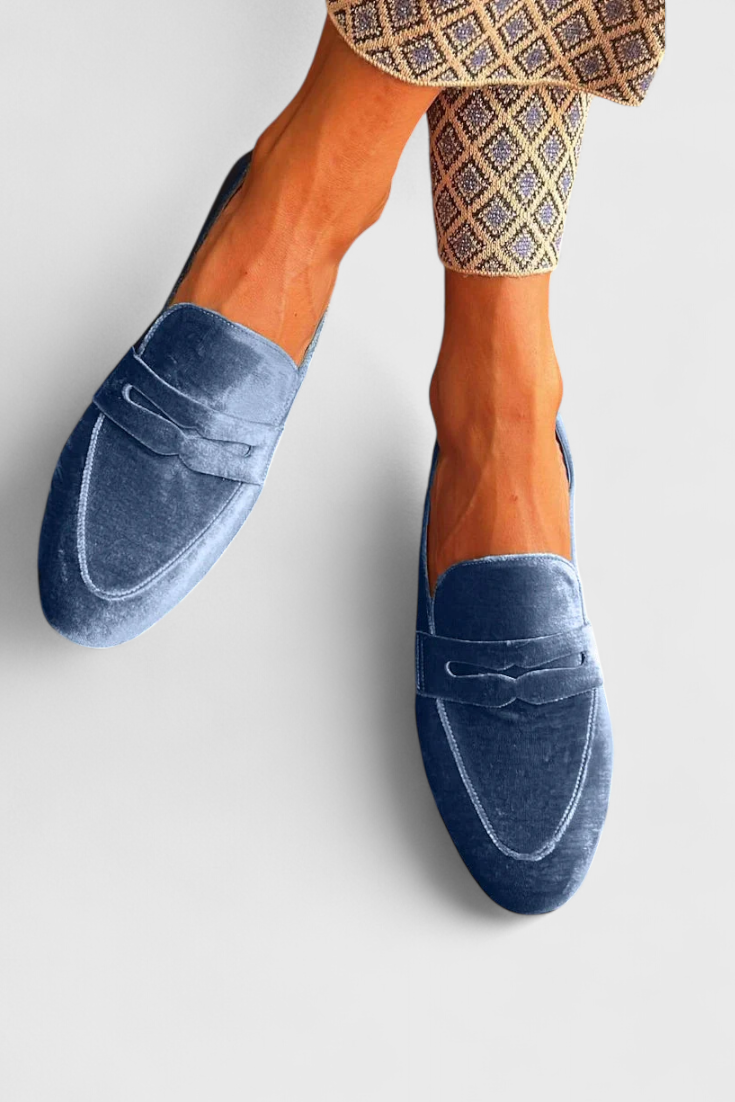 Classic women's blue slip-on loafers. Comfortable flat shoes ideal for everyday style, workwear & versatile looks.