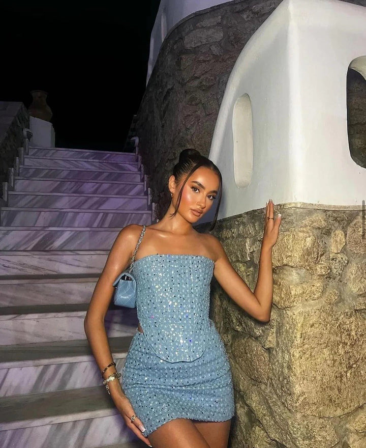 Shimmering blue strapless bodycon mini dress for women. Sparkle party dress, perfect for a glamorous night out.