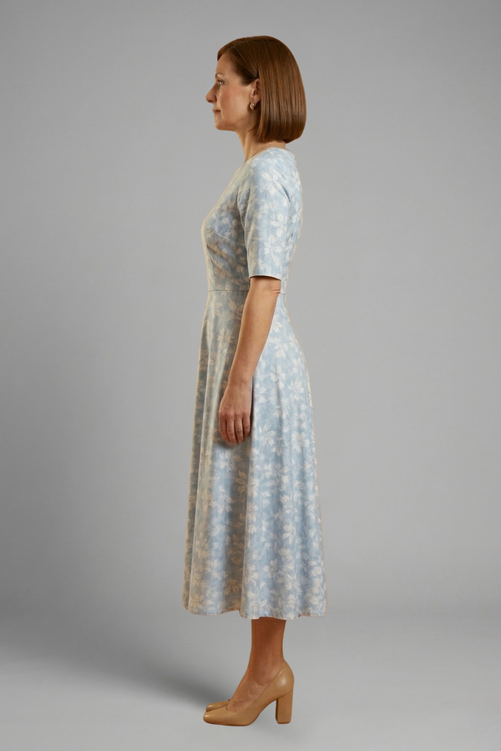Stylish blue women's midi dress. V-neck, short sleeves, & side pockets offer a comfortable, versatile casual look.