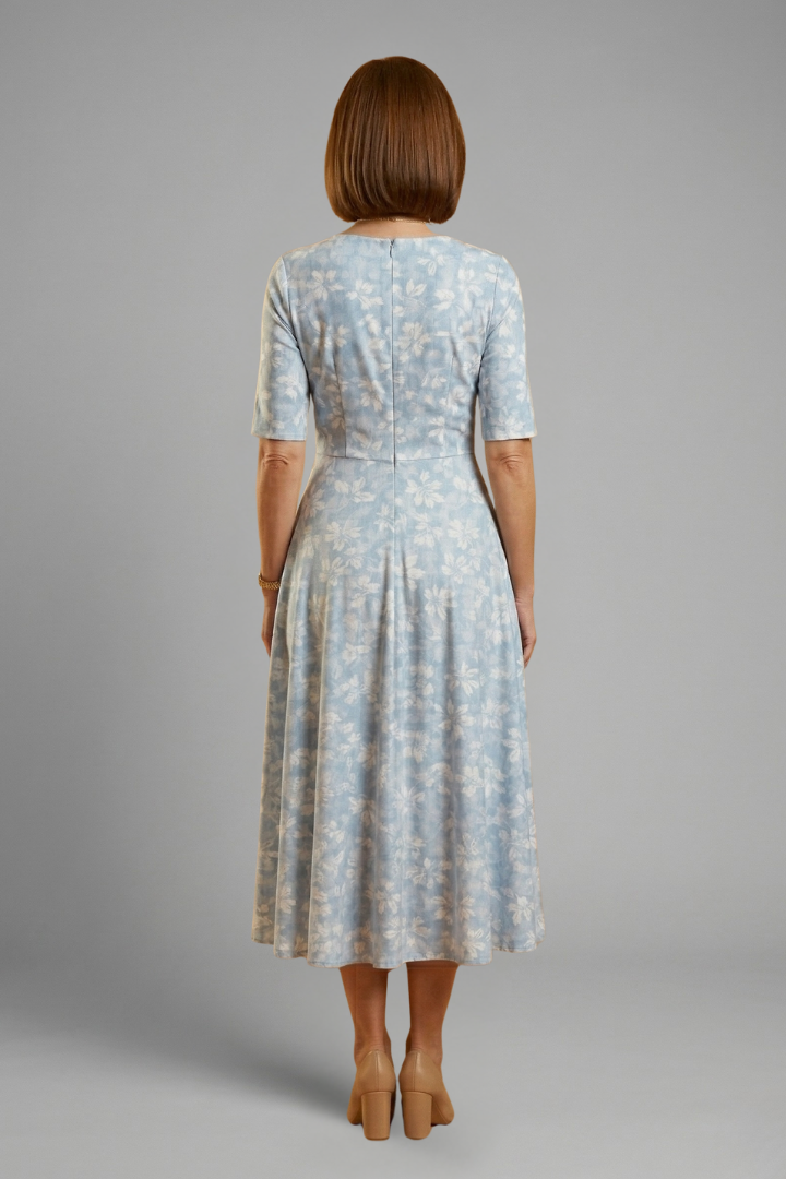 Comfortable women's blue V-neck midi dress. Short sleeves & side pockets make this a perfect relaxed fit casual dress.