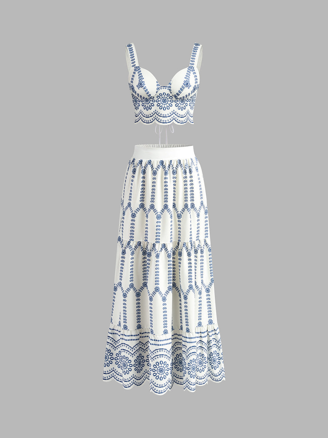 Women's blue & white printed sleeveless crop top and tie-back maxi skirt set, perfect for summer vacation.