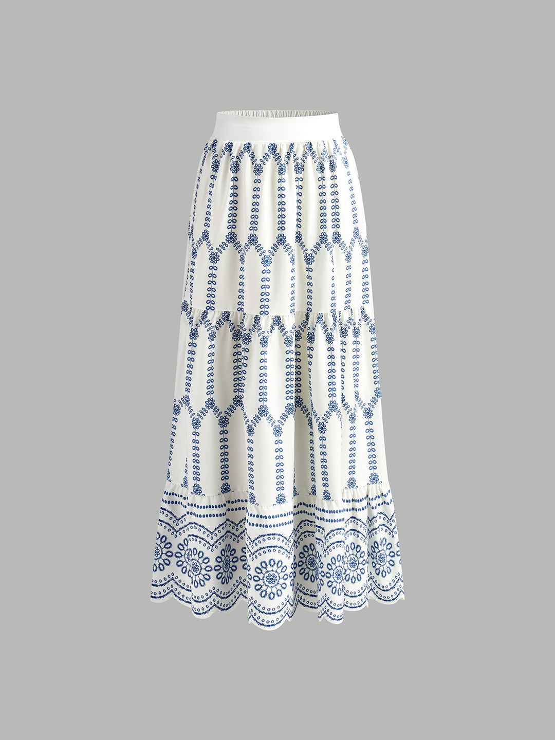 Blue and white printed sleeveless skirt set for women, featuring a trendy tie-back top and flowing maxi skirt.