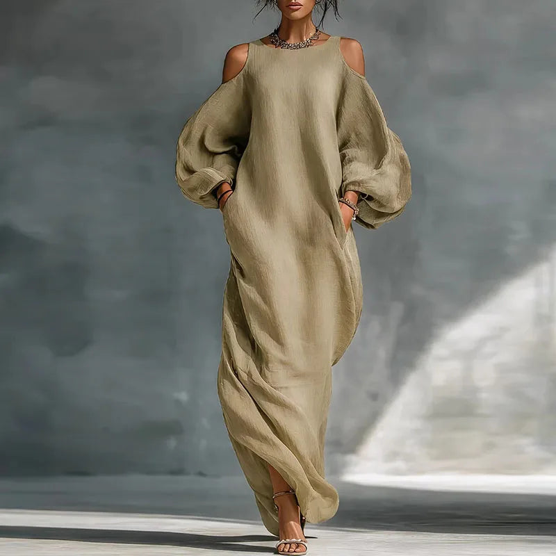 Chic women's bohemian cold shoulder maxi dress. Versatile, long sleeve, flowing for casual or elegant spring/summer fashion.