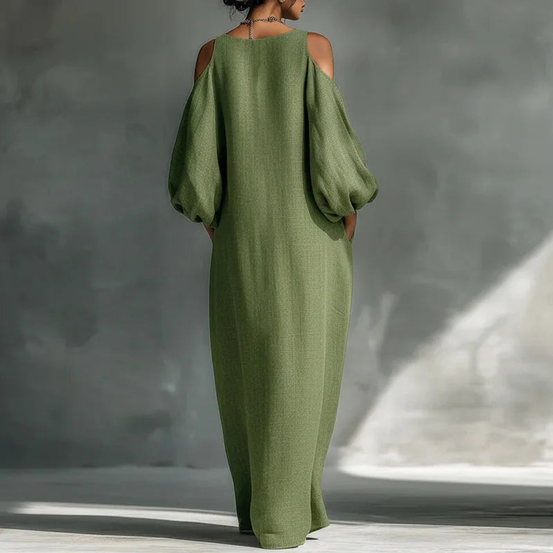 Effortless women's bohemian long sleeve cold shoulder maxi dress. Flowing design for relaxed, casual chic summer fashion.