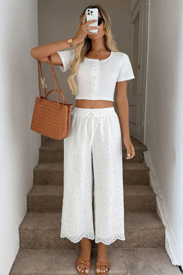 Boho capri pants for women, eyelet detail, relaxed fit, stylish summer vacation & travel essential.