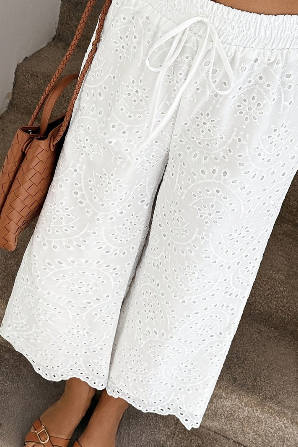 Stylish women's relaxed fit capri pants, eyelet detail, boho summer fashion, great for travel.