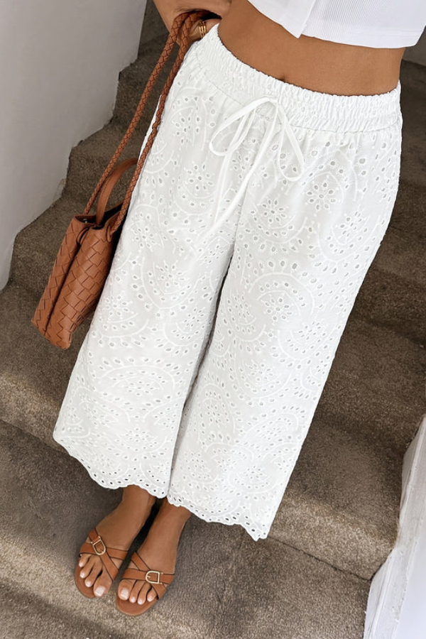Women's bohemian summer vacation pants, cropped length, relaxed fit, ideal casual warm weather wear.