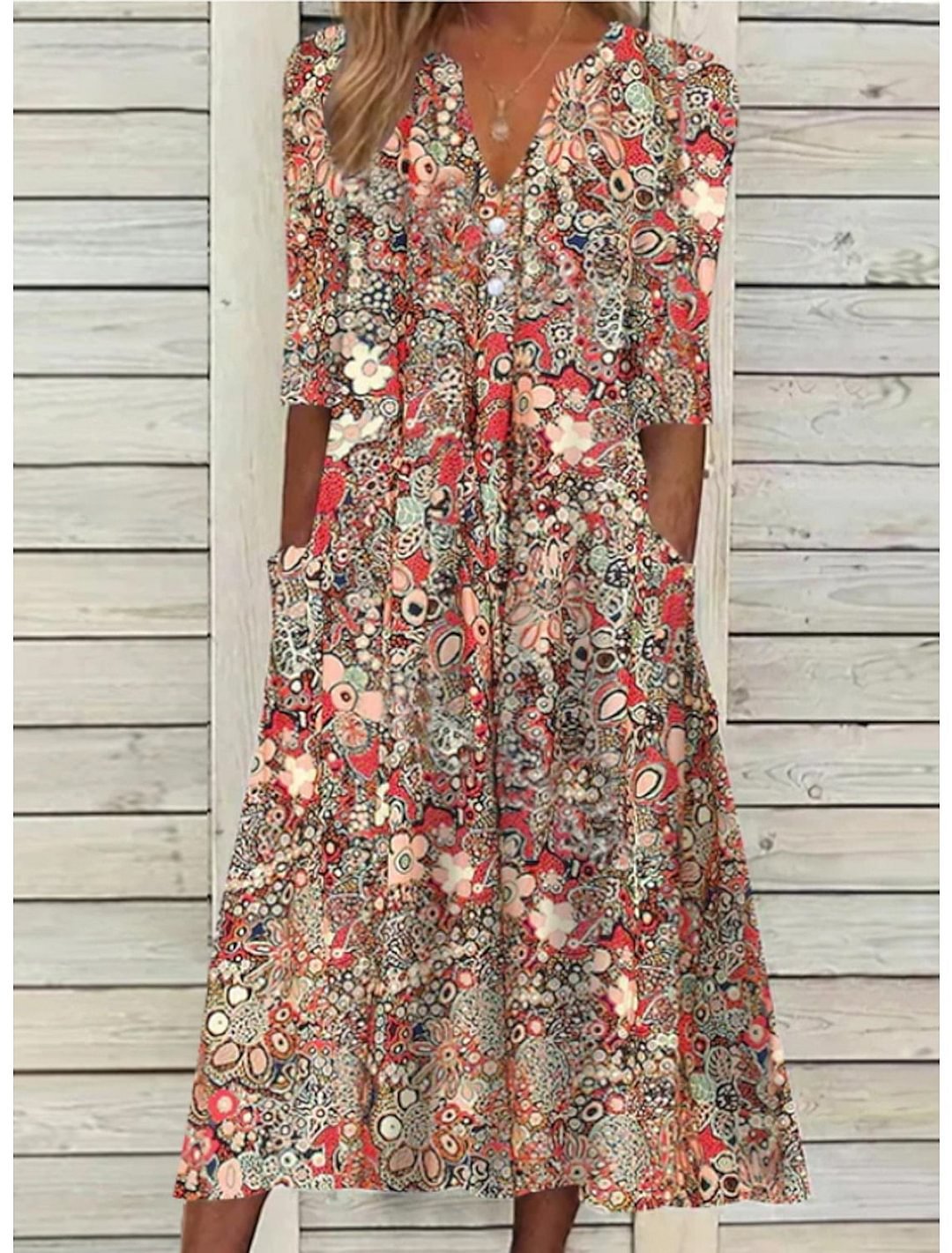 Women's bohemian floral print midi dress with relaxed fit, V-neck, and half sleeves for casual summer style.