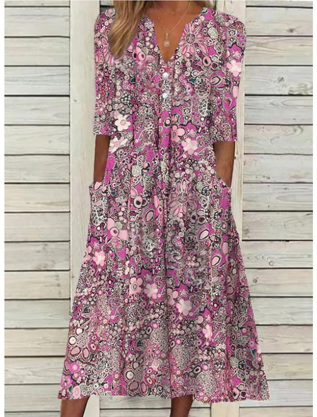 Comfortable women's bohemian floral print midi dress featuring a V-neck and half sleeves, ideal for warm weather.