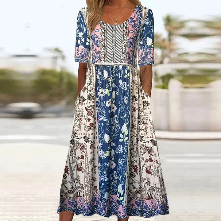Printed midi dress for women with convenient pockets & short sleeves. Boho casual style, ideal for everyday summer wear.