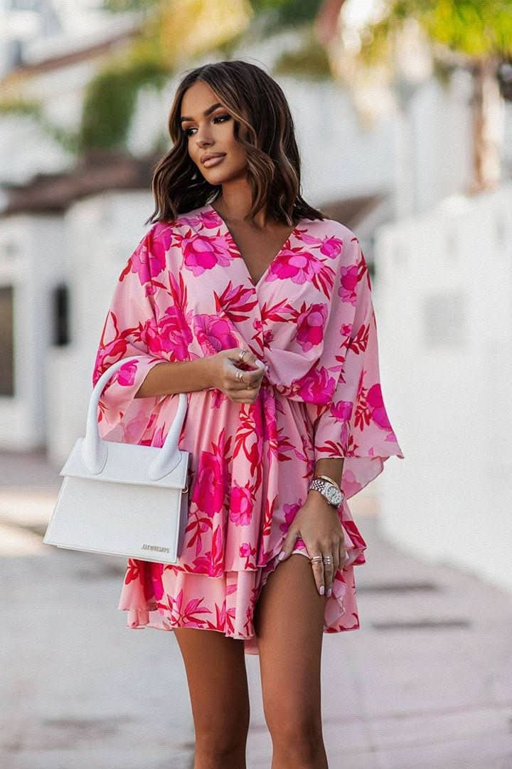 Women's off-shoulder mini dress with a bohemian print, short sleeves, and a flattering A-line silhouette.