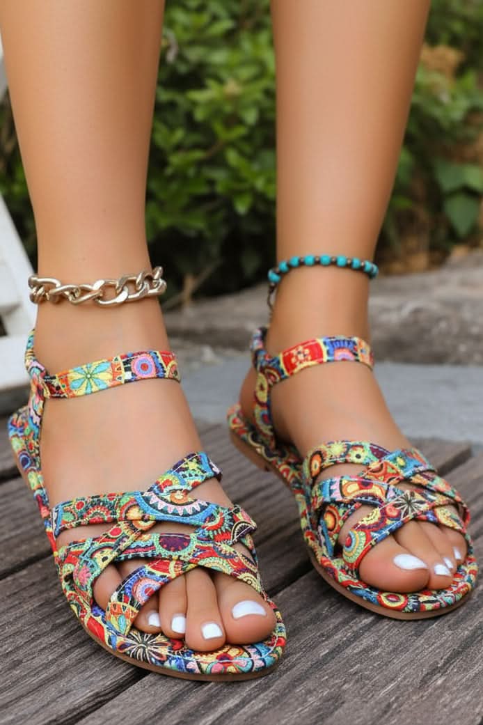 Women's bohemian print T-strap flat sandals, perfect for summer casual wear & vacation. Vibrant colorful design, open toe.
