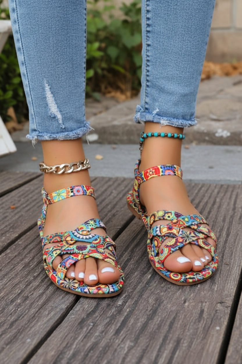 Women's flat bohemian T-strap sandals with colorful print, great for summer, beach, or casual outings. Comfortable design.