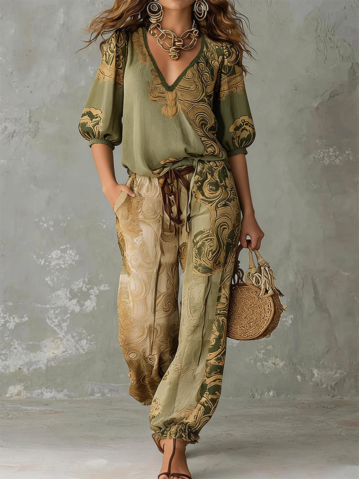 Effortless bohemian print co-ord set with a v-neck half-sleeve top and wide-leg pants for women's casual wear.