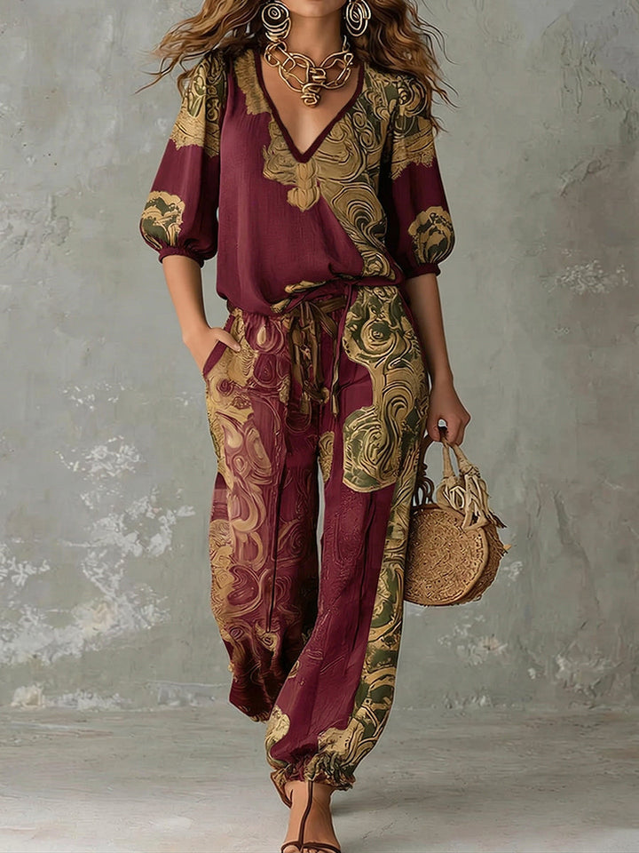 Chic women's bohemian print summer fashion set, including a relaxed v-neck top and coordinating casual pants.
