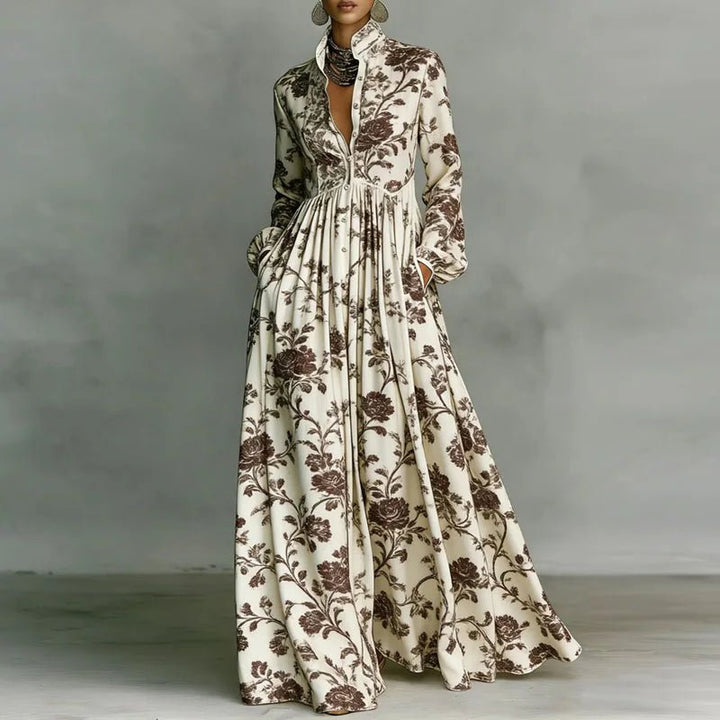 Elegant casual women's printed maxi dress. Features a stand collar, button front, long sleeves & high waist.