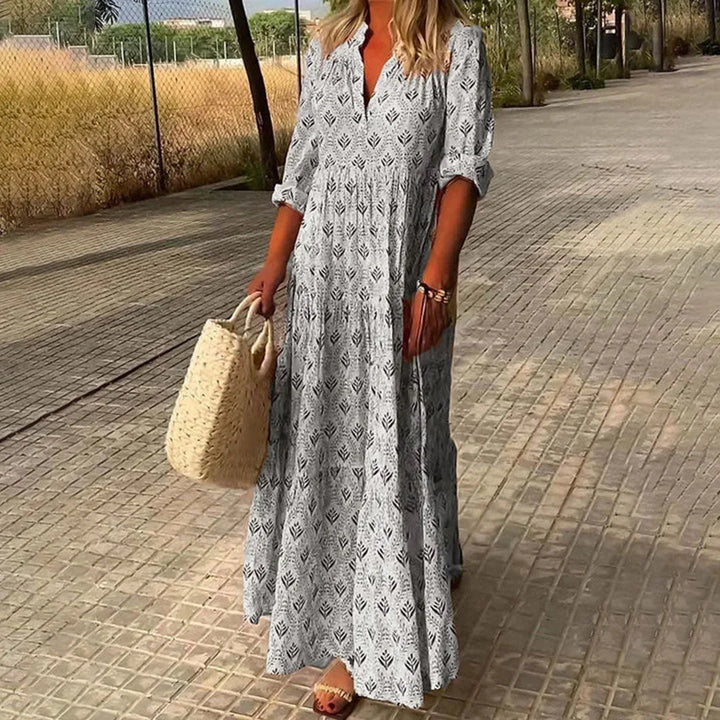 Elegant Women's V-neck maxi dress, long sleeves, bohemian style, ideal as a summer or beach casual dress.