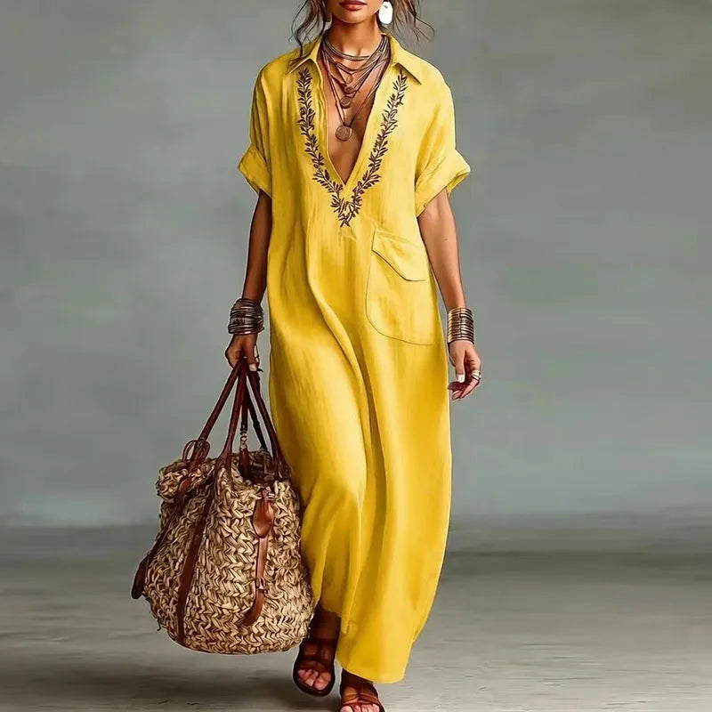 Flowy short sleeve women's maxi dress with V-neck & vibrant bohemian print, perfect for summer fashion.