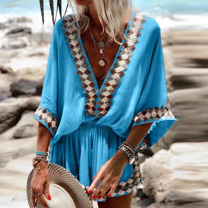 Women's bohemian V-neck short jumpsuit, perfect for summer vacation. Flowy, relaxed fit & chic beach style.