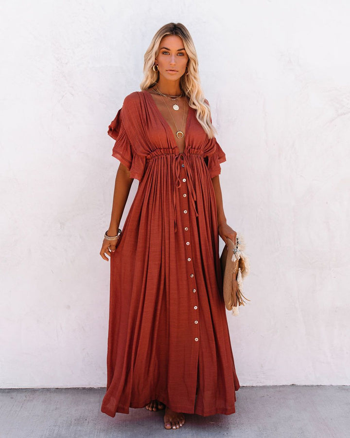 Elegant women's flowing kimono dress with v-neck, perfect as a boho beach cover up or stylish resort wear.