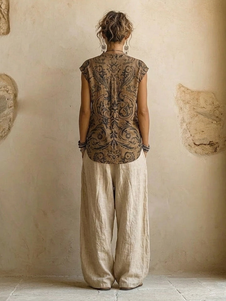 Stylish women's boho chic wide leg pants and flowy cardigan set with a unique ethnic print. Great for spring fashion.