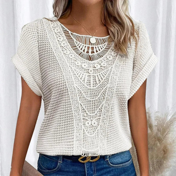 Chic women's boho crochet casual top, short sleeve, relaxed fit. Ideal for versatile summer style.