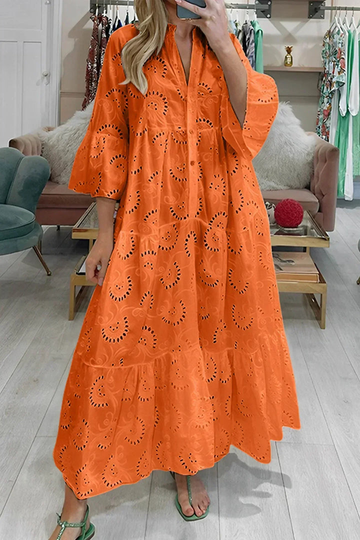 Flowy V-neck boho maxi dress for women, featuring intricate embroidery & wide sleeves, ideal for summer style.