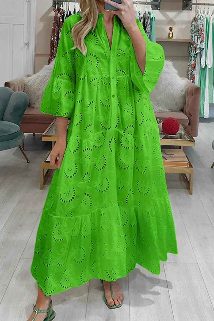 Chic women's flowy boho maxi dress, embroidered details, V-neck, and wide sleeves, essential for summer fashion.