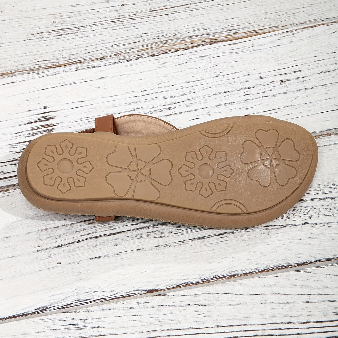 Comfortable women's flat boho sandals. Beaded and rhinestone toe ring design for summer adventures.