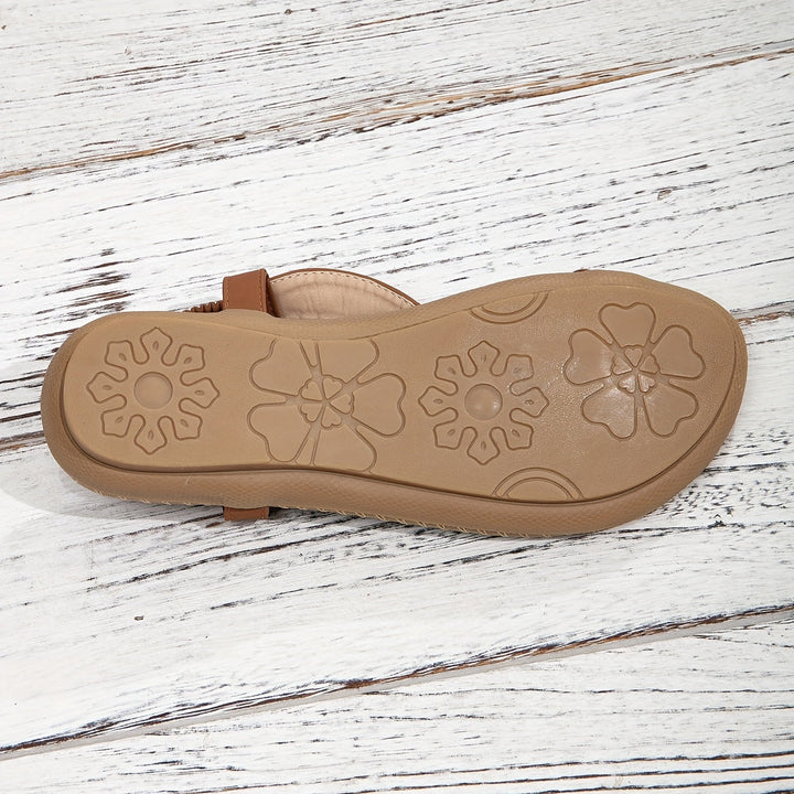 Comfortable women's flat boho sandals. Beaded and rhinestone toe ring design for summer adventures.