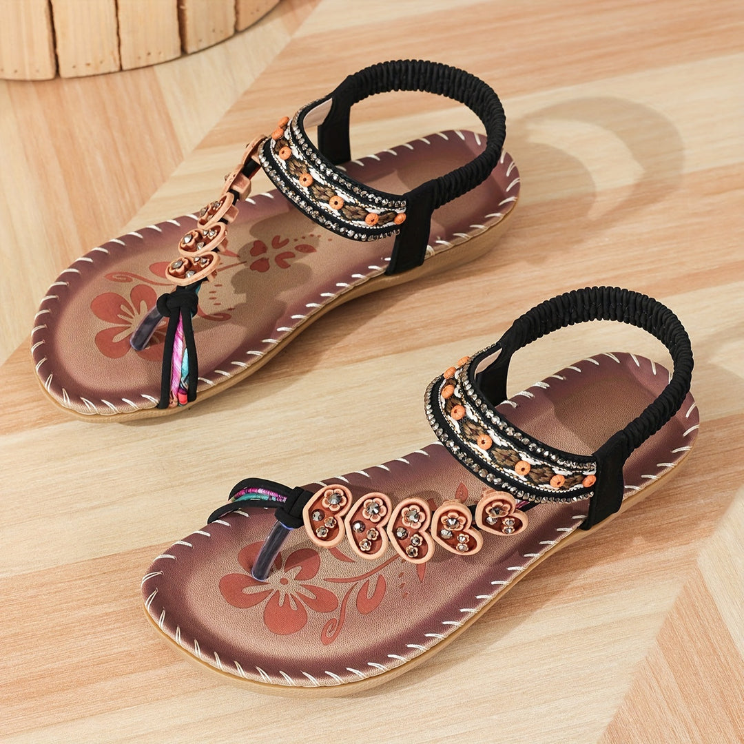 Comfortable women's flat toe ring sandals. Boho style with intricate rhinestone and bead embellishments.