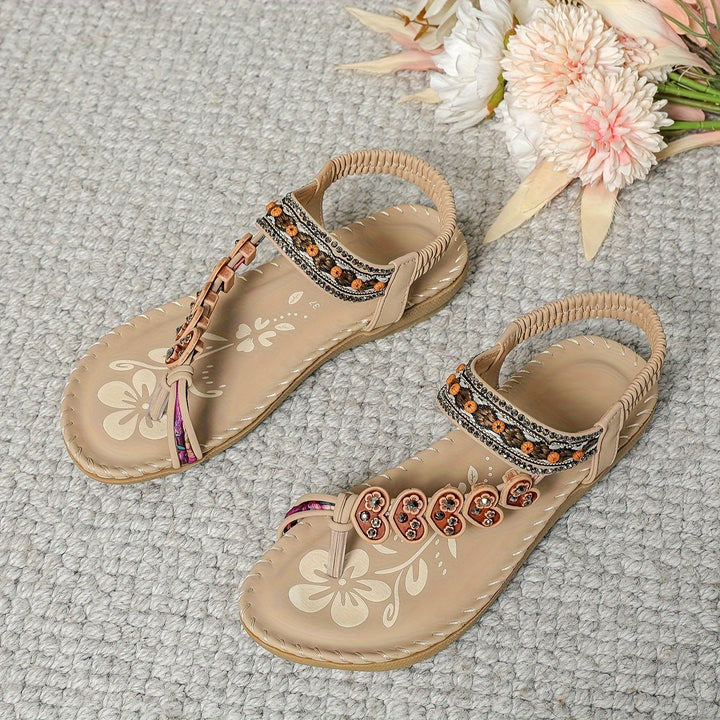 Stylish women's summer sandals. Flat, beaded, and rhinestone toe ring for casual elegance.