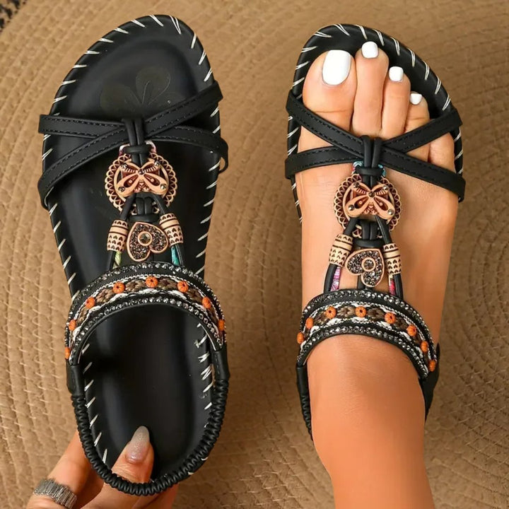Supportive women's orthopedic flat sandals with T-strap, ideal for summer walking.