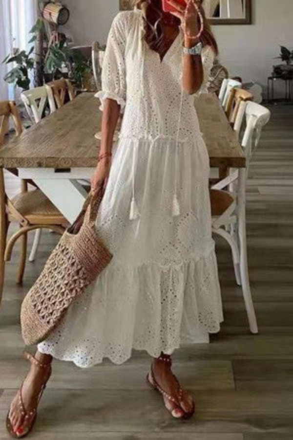 Flowy boho floral maxi dress for women, featuring a V-neck, tassel ties, ideal for beachwear & casual elegance.