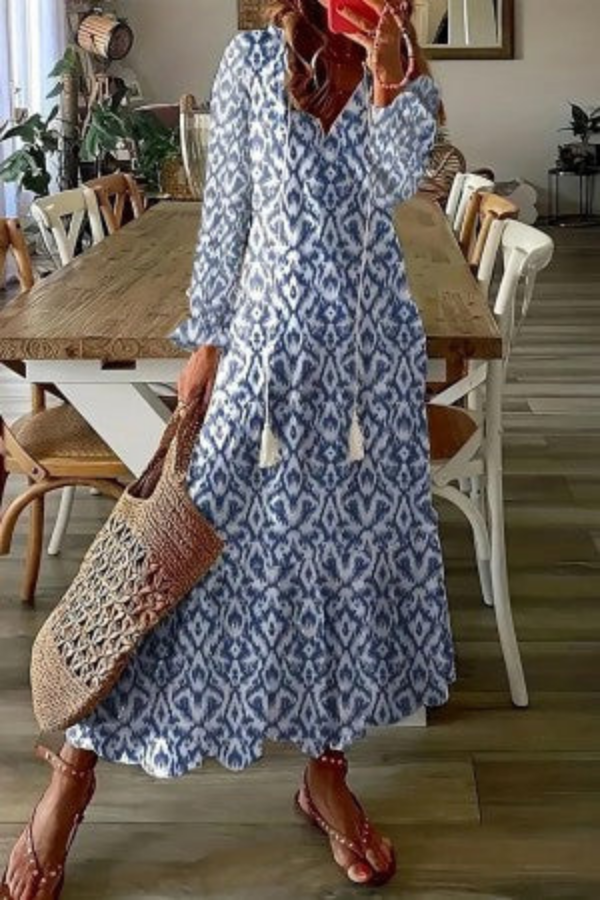 Boho floral print V-neck maxi dress for women, featuring elegant tassel details. Ideal for summer fashion & vacations.