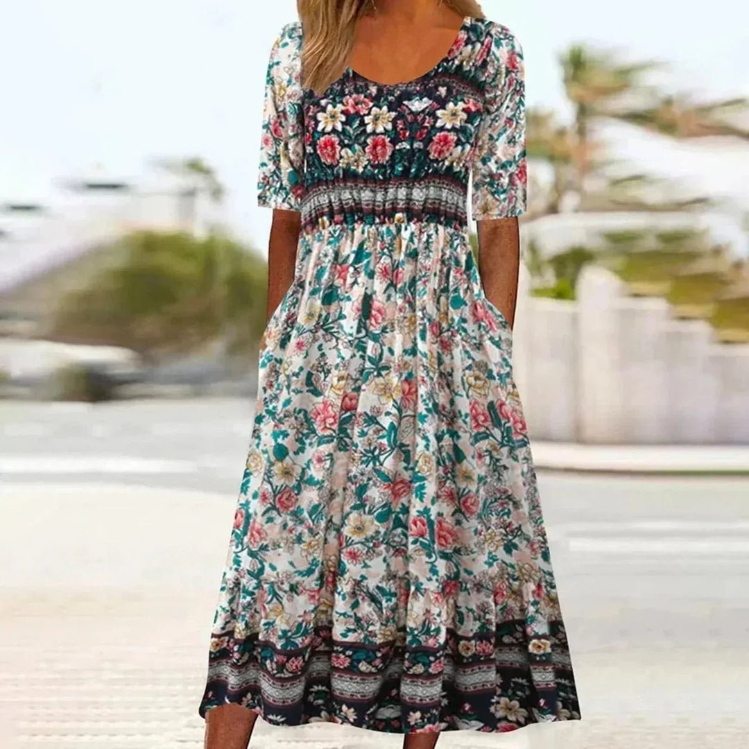 Beautiful women's floral maxi dress. Boho style with short sleeves & square neck, ideal for warm weather comfort.